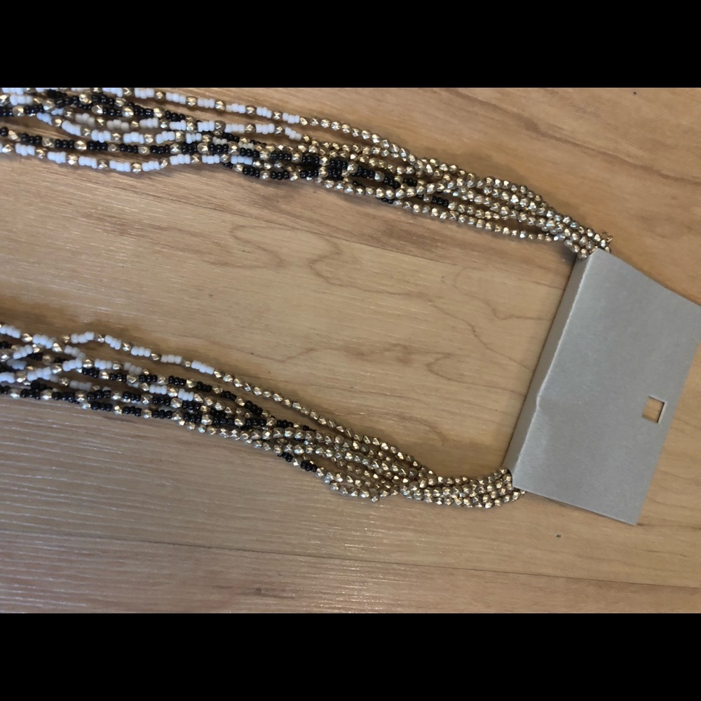 Black, gold, and white necklace